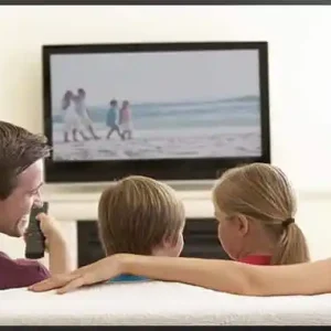 Family watching live TV and streaming entertainment through IPTV service on a Smart TV.